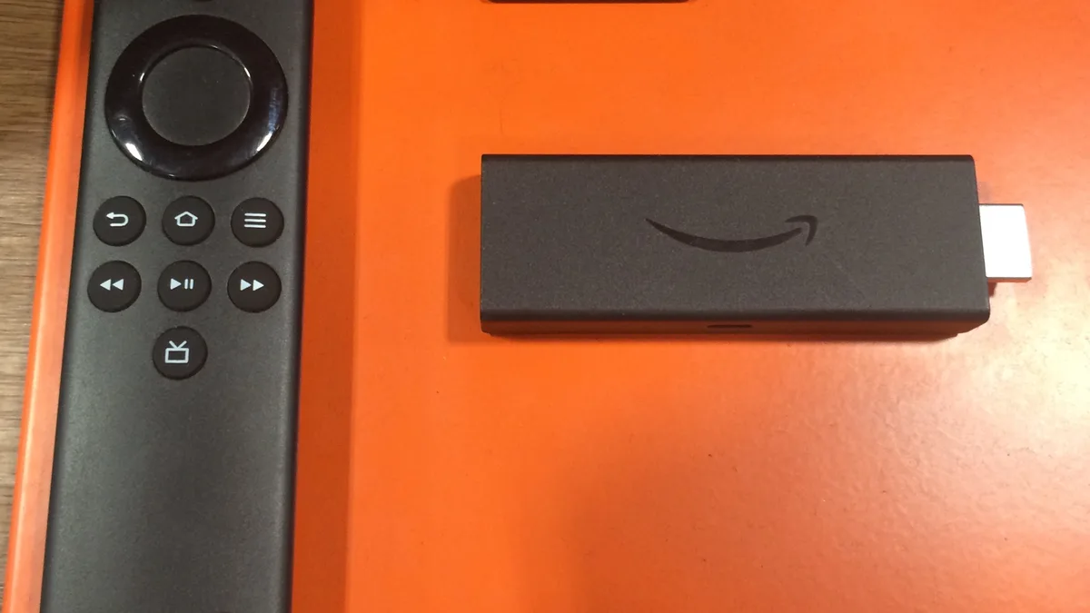 Amazon Fire TV Stick and remote control, representing IPTV app crashes, login, and playlist troubleshooting