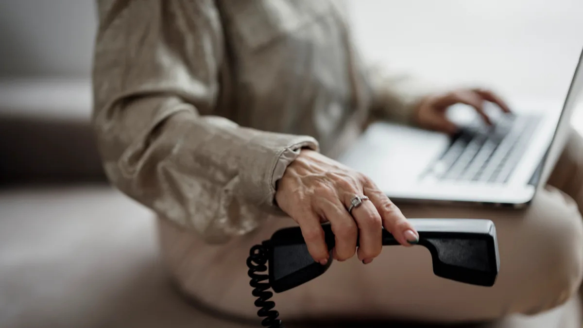 Photo by Shixart1985, licensed under CC BY 2.0 (Wikimedia Commons) Person researching an IPTV provider while on a call