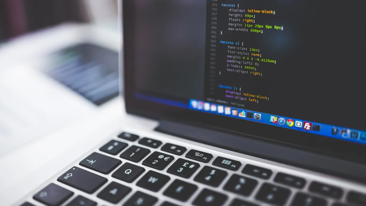 Laptop screen displaying lines of code